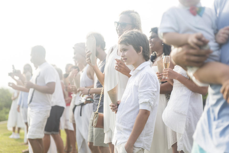 Image of wedding guests represents 10k covid wedding planned