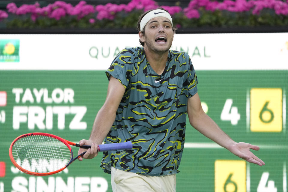 Taylor Fritz reacts to losing a point to Jannik Sinner, of Italy, at the BNP Paribas Open tennis tournament Thursday, March 16, 2023, in Indian Wells, Calif. (AP Photo/Mark J. Terrill)