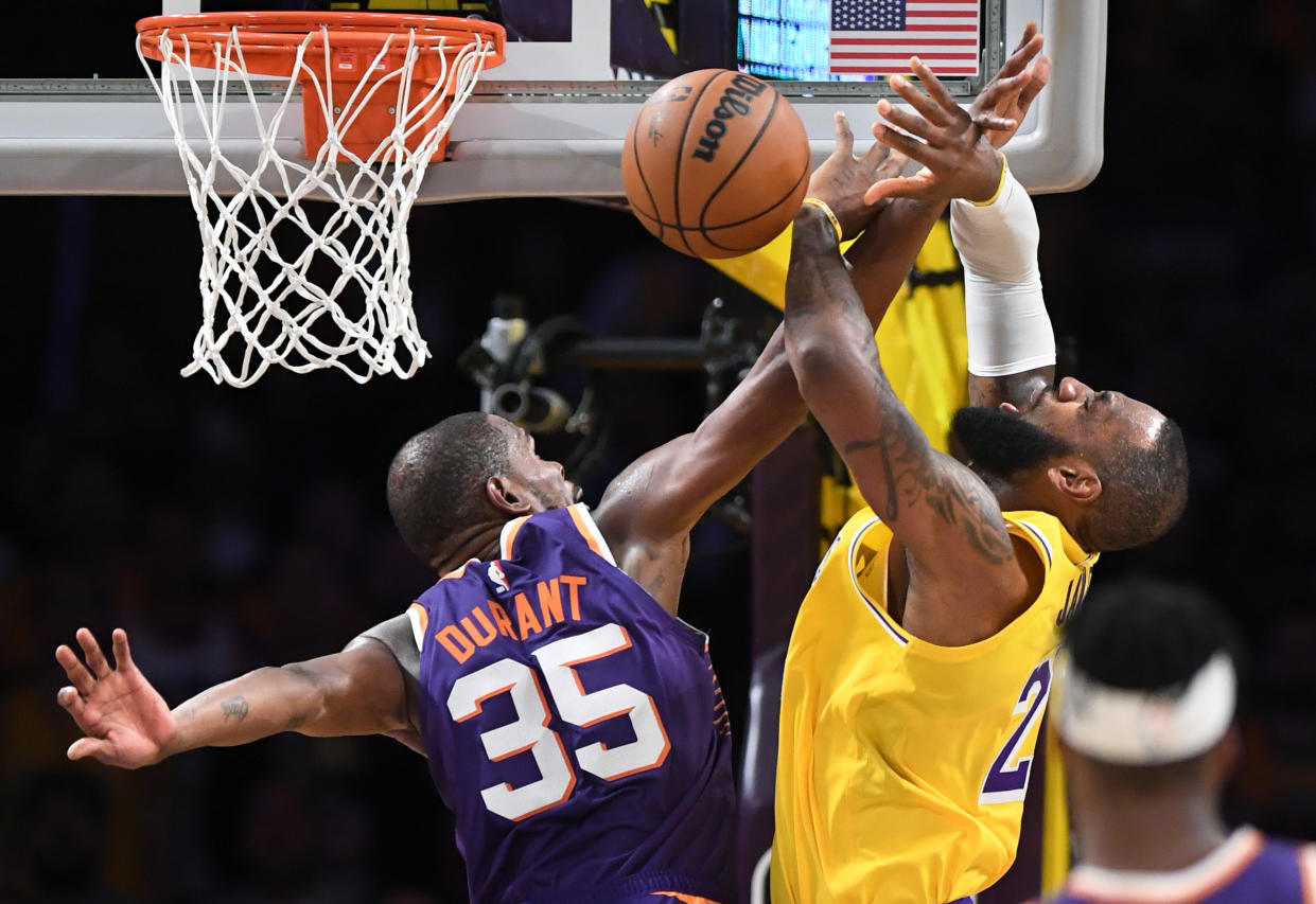 Los Angeles, California October 26, 2023-Lakers LeBron James is fouled by Suns Kevin Durant in the fourth quarter at Crypto.com Thursday. (Wally Skalij/Los Angeles Times via Getty Images)