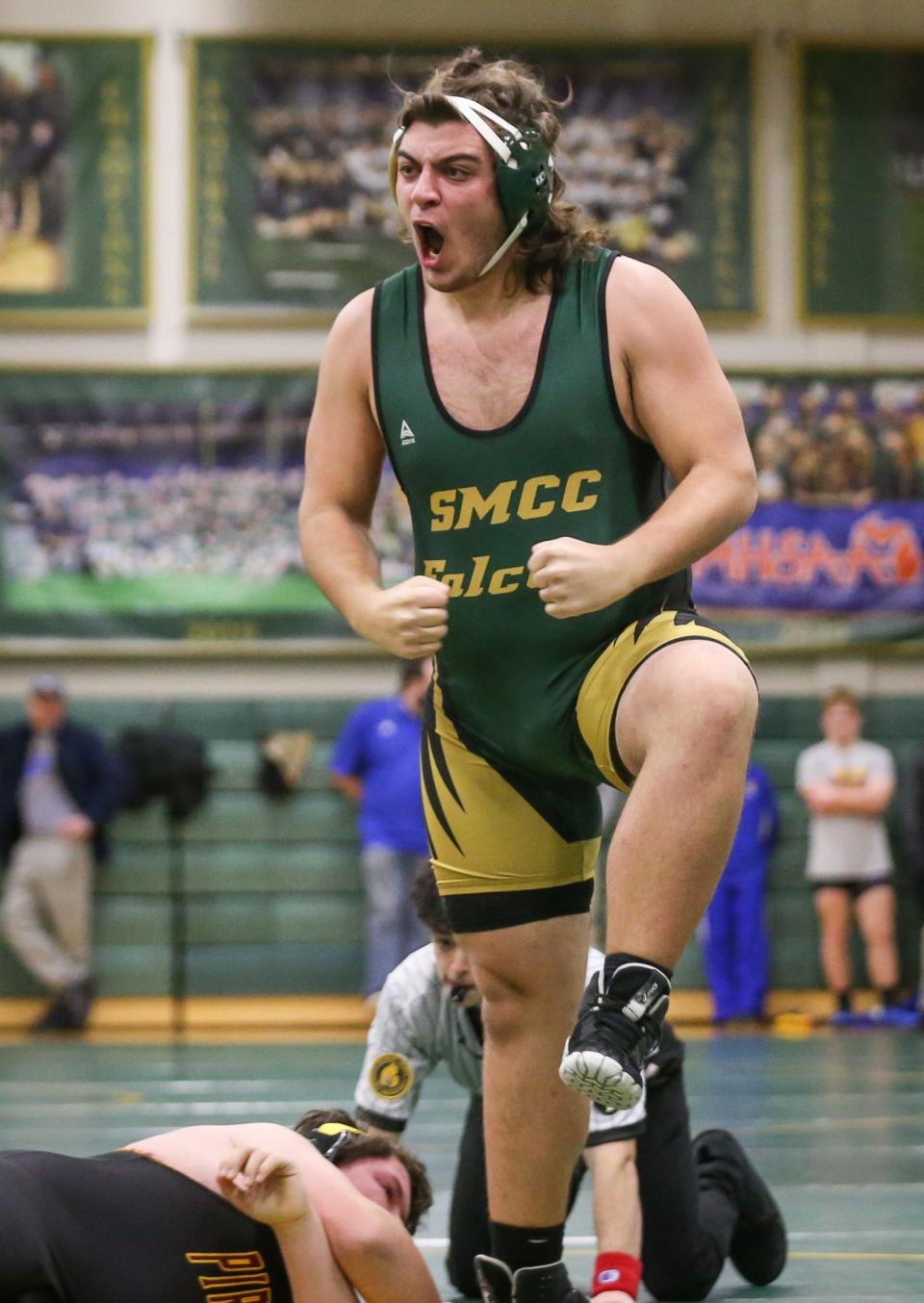 Murphy Bogdanski of St. Mary Catholic Central celebrates a pin of Riverview's Don Spurlock at 285 pounds Wednesday night.