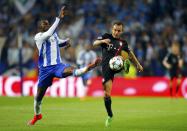 Bayern Munich's Rafinha (R) and Porto's Jackson Martinez fight for the ball during their Champions League quarterfinal first leg soccer match at Dragao stadium in Porto April 15, 2015. REUTERS/Miguel Vidal TPX IMAGES OF THE DAY