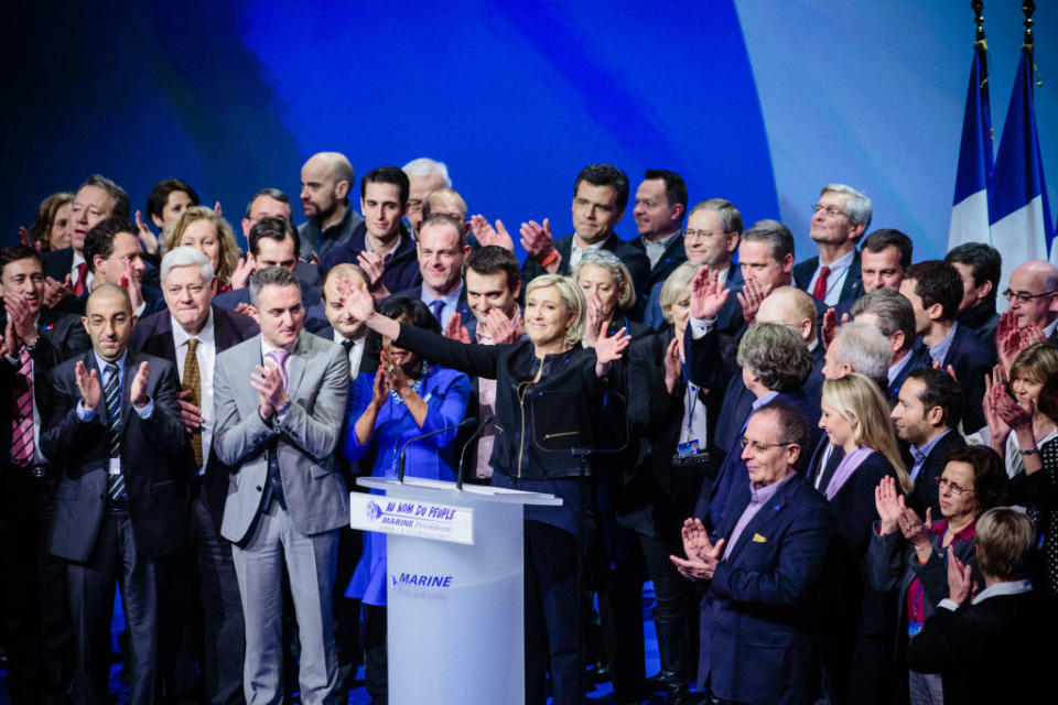 LYON, FRANCE – FEBRUARY 05: French far right National Front (FN) political party’s leader, Member of the European Parliament, and candidate for the 2017 French Presidential Election Marine Le Pen (C) is surrounded by her supporters at the end of her meeting during her ‘Assises de la présidentielle’ at the Cite internationale on February 5, 2017 in Lyon, France. Nearly 3000 supporters came to listen the political program of Marine Le Pen titled ‘144 Presidential Commitments’. (Photo by Aurelien Morissard/IP3/Getty Images)