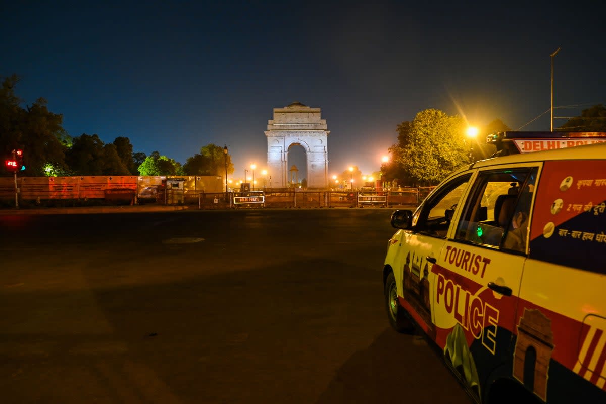 File Police keep vigil at an empty street in New Delhi in 2021 as the Indian capital  (AFP via Getty Images)