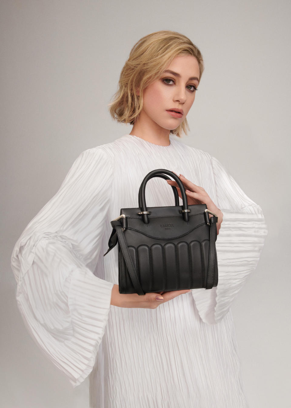 Lili Reinhart with the Rodeo bag in Lancel's spring campaign