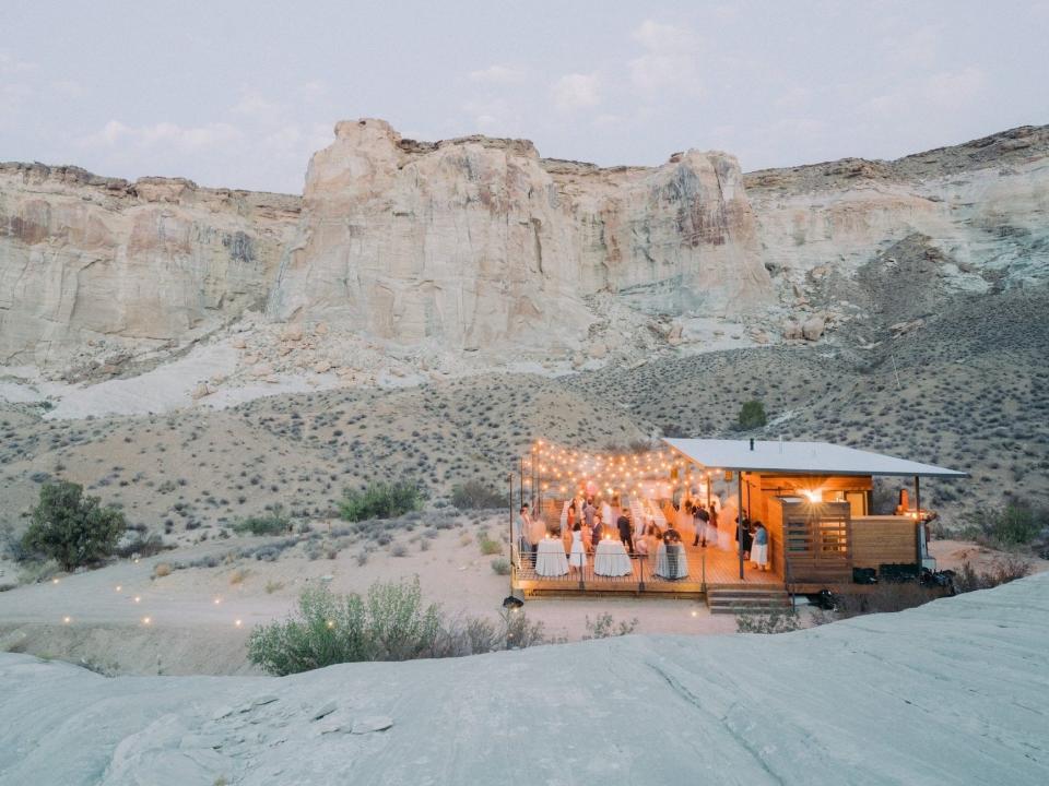 A wedding party on a patio in the desert.