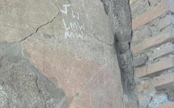 Initials on Pompeii's House of the Vestals illustrates