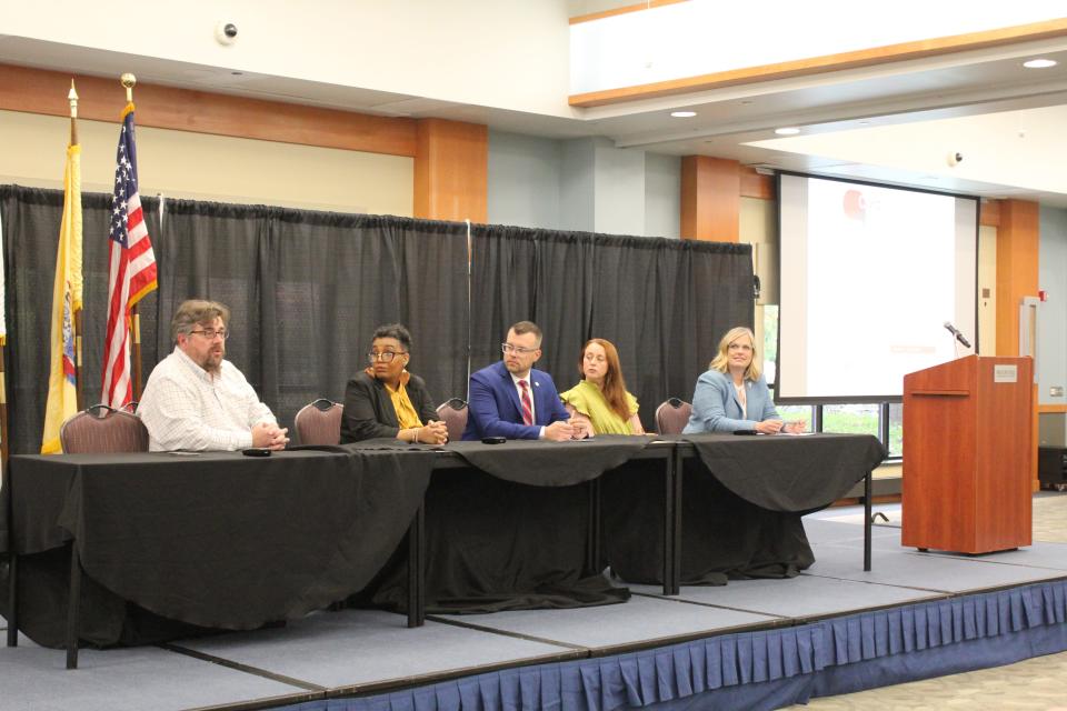Panelists discuss 'Civility in an Uncivil Time' at Brookdale Community College's 2023 Civic Engagement Conference. Samantha and John Roman sit second and third from right.