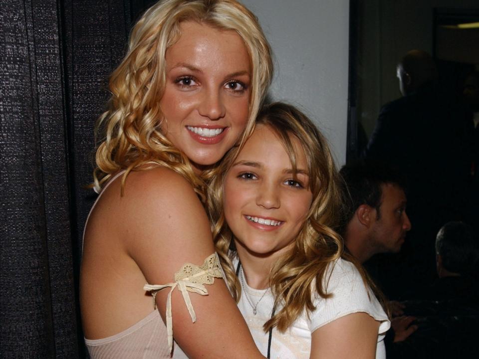 Britney Spears and Jamie Lynn Spears backstage during the 2003 Kids' Choice Awards.