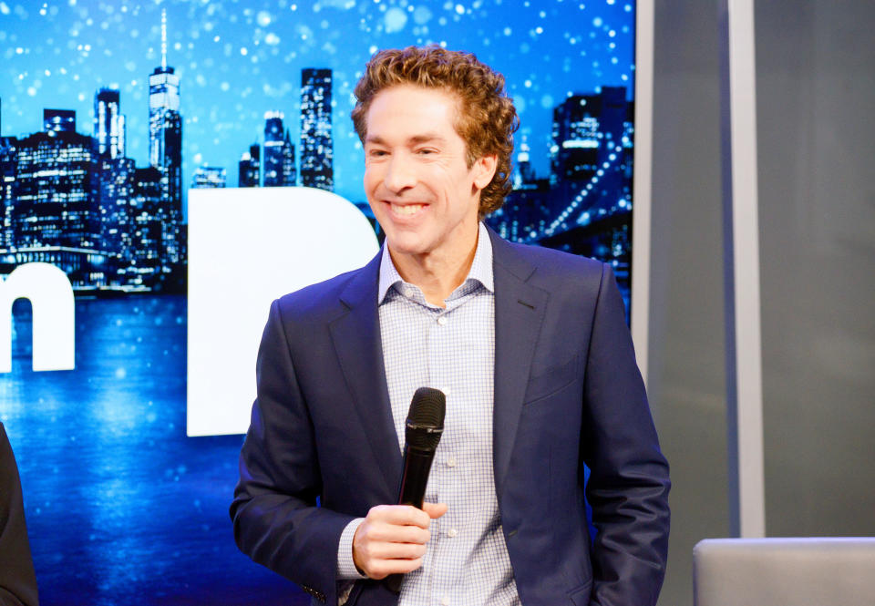 Joel Osteen speaks on a mic