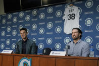 Jerry Dipoto, left, Seattle Mariners President of Baseball Operations, and new Seattle Mariners pitcher Robbie Ray, right, speak Wednesday, Dec. 1, 2021, during a news conference in Seattle. The AL Cy Young Award winner — who previously pitched for the Toronto Blue Jays — signed a five-year contract with the Mariners. (AP Photo/Ted S. Warren)