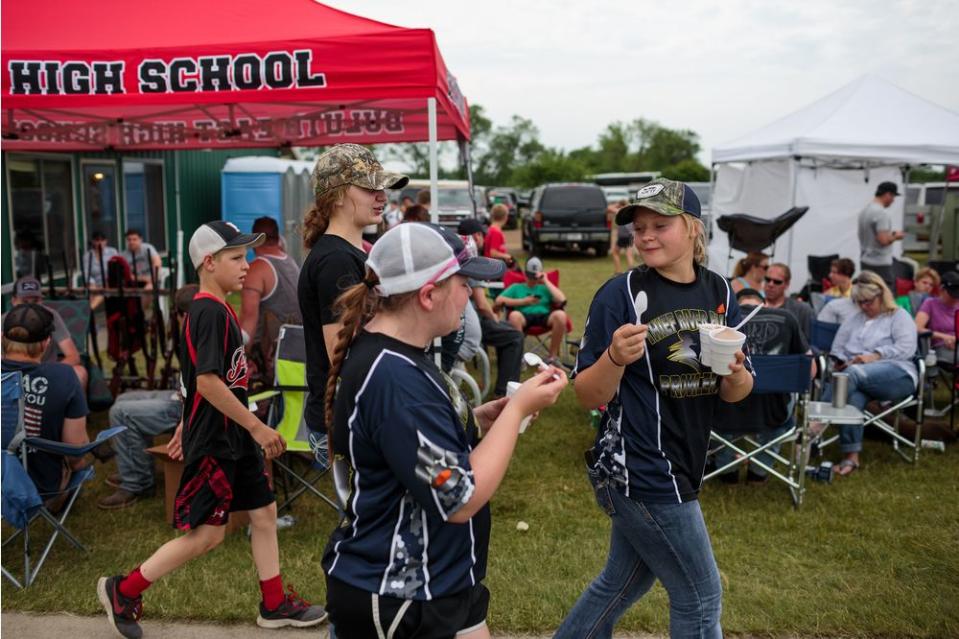 Students from Thief River Falls take an ice cream break in 90 degree weather after competing.