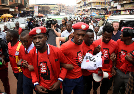 Ugandan musician turned politician, Robert Kyagulanyi (C) leads activists during a demonstration against new taxes including a levy on access to social media platforms in Kampala, Uganda July 11, 2018. REUTERS/Newton Nambwaya/Files