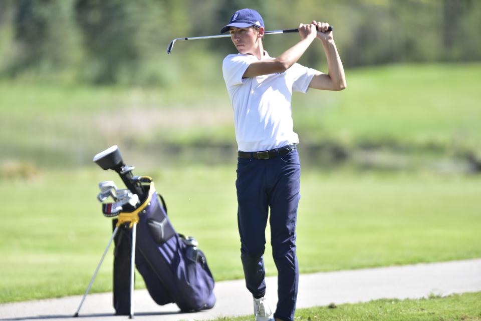 Port Huron Northern's Luke Maher takes a practice swing during the Huskies' 171-178 win over Utica at Stony Creek Metropark Golf Course in Shelby Township on Thursday, May 11, 2023. Northern clinched the MAC White title with the victory.