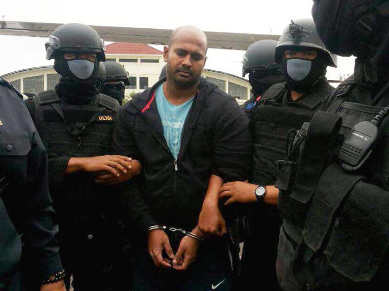 Indonesian police escort Myuran Sukumaran as he arrives in Cilacap on March 4, on his way to a maximum security prison in Nusa Kambangan island