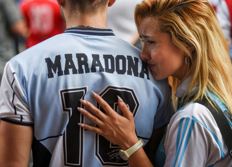 Image: Mourners outside the Diego Armando Maradona stadium, in Buenos Aires (Martin Villar / Reuters)