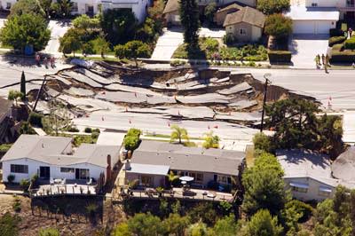 <b>Aren't you glad you don't live there? A landslide caused this 200-by-240-foot sinkhole near San Diego, Calif. Watch natural disaster videos.</b> Kent Horner/<a class="link " href="http://www.gettyimages.com/Home.aspx" rel="nofollow noopener" target="_blank" data-ylk="slk:­Getty Images;elm:context_link;itc:0;sec:content-canvas">­Getty Images</a>