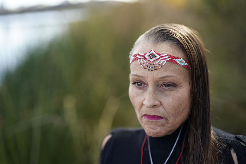 Moonlight Pulido poses for a portrait Wednesday, Dec. 7, 2022, in Los Angeles. California is paying reparations to victims, mostly women, who were either forcibly or coercively sterilized by the government. Pulido was sterilized while incarcerated in 2005. (AP Photo/Marcio Jose Sanchez)