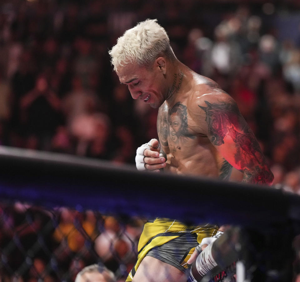 Charles Oliveira reacts after defeating Beneil Dariush by technical knockout during a lightweight bout at UFC 289 in Vancouver, British Columbia on Saturday, June 10, 2023. (Darryl Dyck/The Canadian Press via AP)