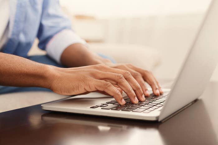 A person typing on a computer