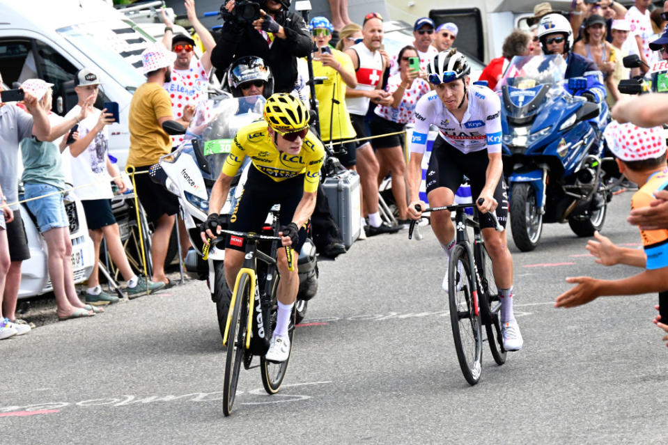 MORZINE LES PORTES DU SOLEIL FRANCE  JULY 15 LR Jonas Vingegaard of Denmark and Team JumboVisma  Yellow leader jersey and Tadej Pogacar of Slovenia and UAE Team Emirates  White best young jersey compete in the breakaway while fans cheers during the stage fourteen of the 110th Tour de France 2023 a 1518km stage from Annemasse to Morzine les Portes du Soleil  UCIWT  on July 15 2023 in Morzine les Portes du Soleil France Photo by Bernard Papon  PoolGetty Images