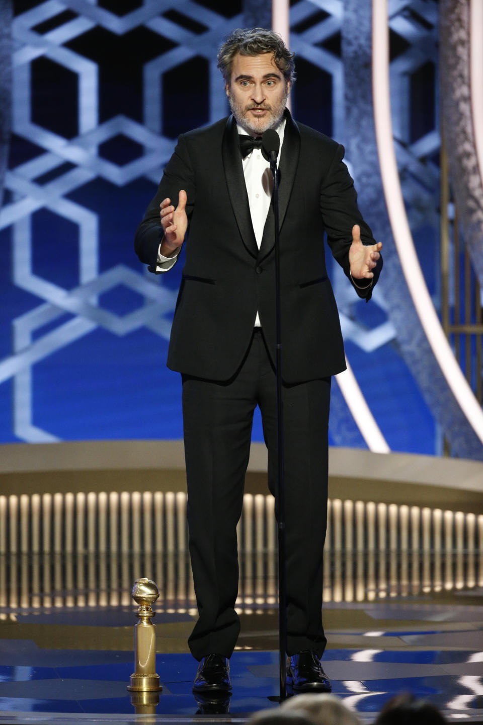 BEVERLY HILLS, CALIFORNIA - JANUARY 05: In this handout photo provided by NBCUniversal Media, LLC,  Joaquin Phoenix accepts the award for BEST PERFORMANCE BY AN ACTOR IN A MOTION PICTURE - DRAMA for "Joker" onstage during the 77th Annual Golden Globe Awards at The Beverly Hilton Hotel on January 5, 2020 in Beverly Hills, California. (Photo by Paul Drinkwater/NBCUniversal Media, LLC via Getty Images)