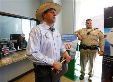 Ammon Bundy, son of rancher Cliven Bundy, walks away after filing a criminal complaint against the Bureau of Land Management at the Las Vegas Metropolitan Police Department in Las Vegas, Nevada May 2, 2014. REUTERS/Mike Blake