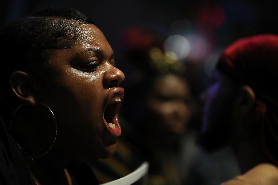 Black Live Matter protesters chant as they block the entrance to the Golden 1 Center.