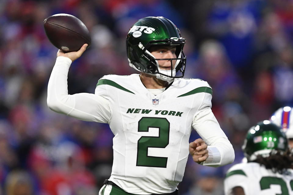 New York Jets quarterback Zach Wilson (2) looks to throw a pass during the first half of an NFL football game against the Buffalo Bills in Orchard Park, N.Y., Sunday, Nov. 19, 2023. (AP Photo/Adrian Kraus)