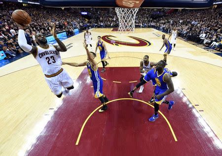 Cleveland Cavaliers forward LeBron James (23) shoots the ball against Golden State Warriors guard Stephen Curry (30) in game six of the NBA Finals at Quicken Loans Arena. Mandatory Credit: Bob Donnan-USA TODAY Sports