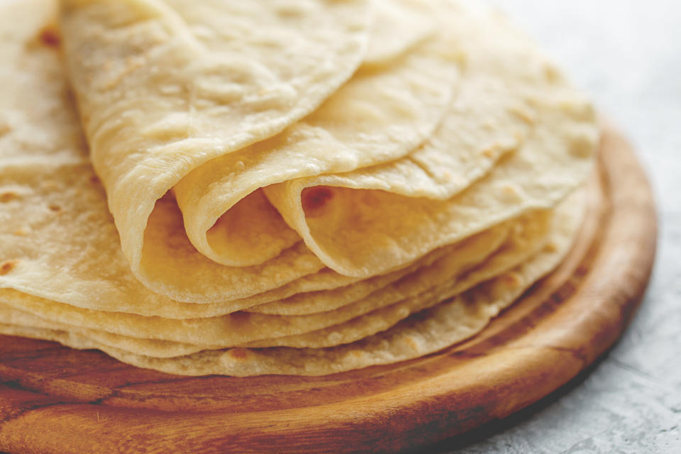 Stack of homemade wheat flour tortillas.