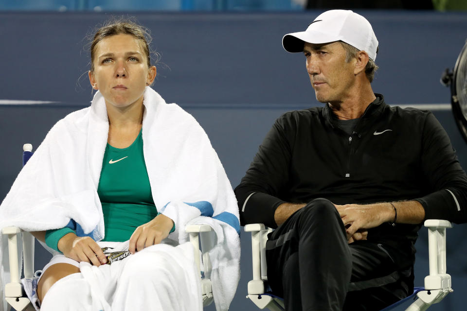 Pictured left to right, Simona Halep sitting with her former coach Darren Cahill.