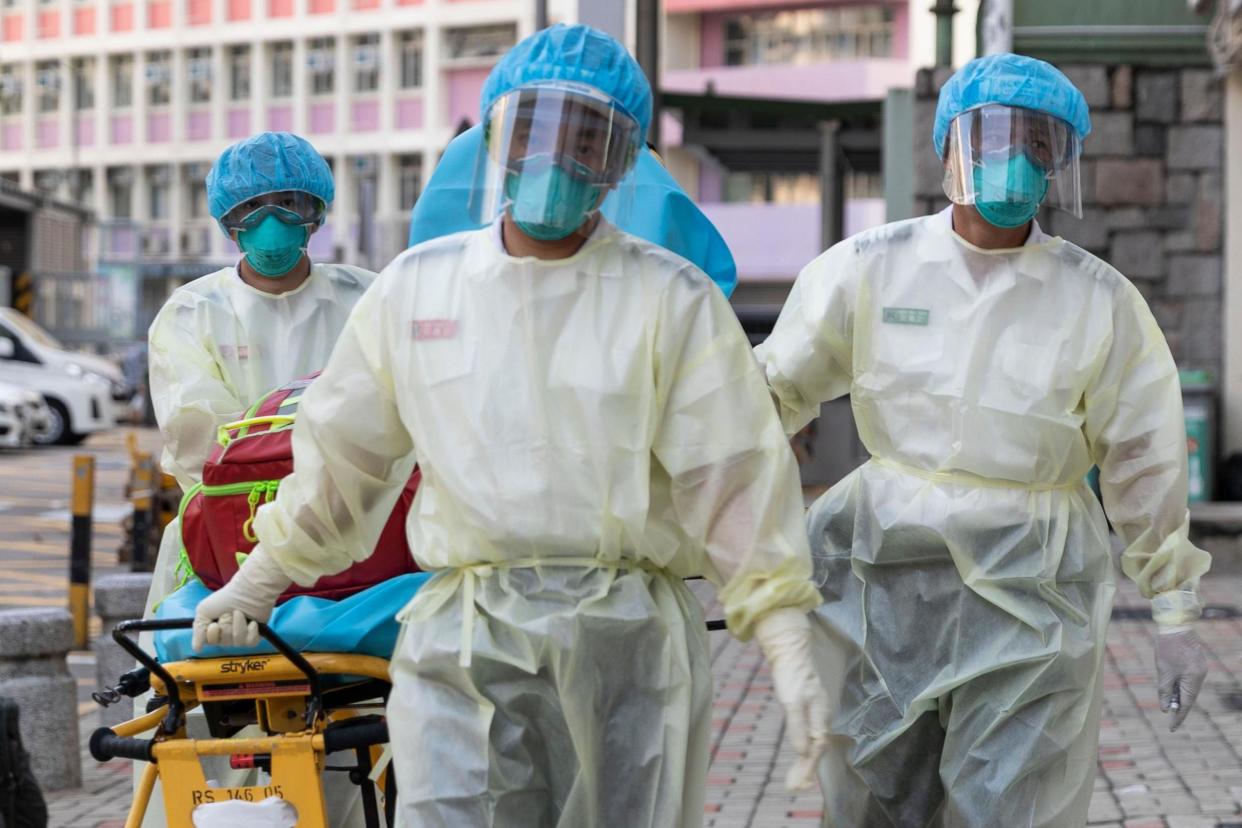 Medical staff wear personal protective equipment as a precautionary measure against coronavirus in Hong Kong: May James/AFP via Getty Images