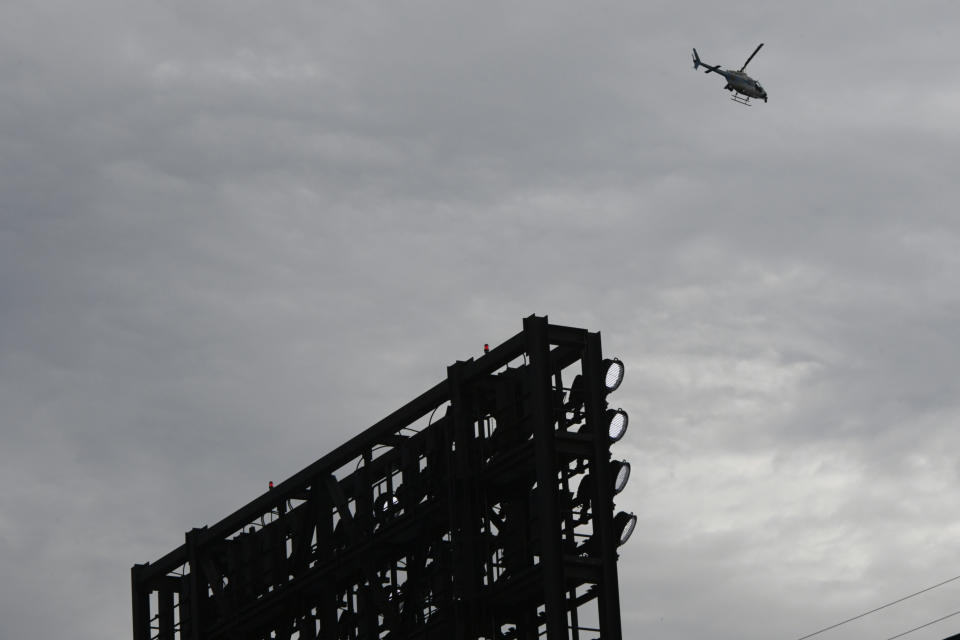 A Chicago Police helicopter flies over Guaranteed Rate Field after a Fourth of July parade shooting in nearby Highland Park, Ill., Monday, July 4, 2022, in Chicago before a baseball game between the Chicago White Sox and the Minnesota Twins. (AP Photo/Paul Beaty)