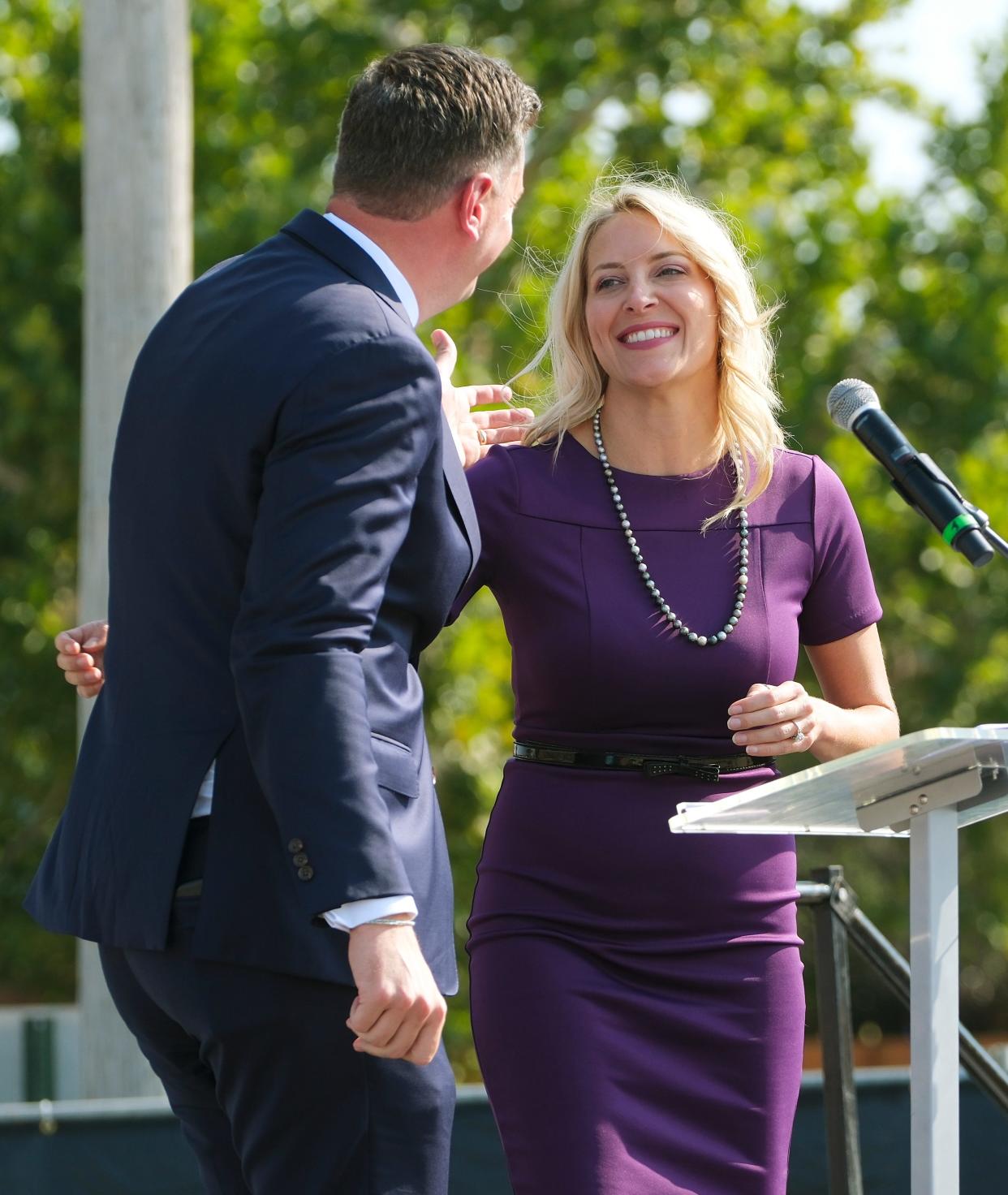 Oklahoma City Mayor David Holt hugs Kim Garrett, founder and chief visionary officer for Palomar and emcee for the day, as he leaves the stage Sept. 13, 2022.