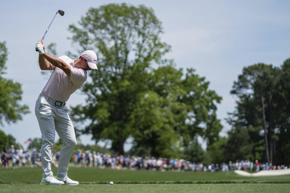 Rory McIlroy tees off on the fourth hole during the fourth round of the Wells Fargo Championship golf tournament at Quail Hollow on Sunday, May 9, 2021, in Charlotte, N.C. (AP Photo/Jacob Kupferman)