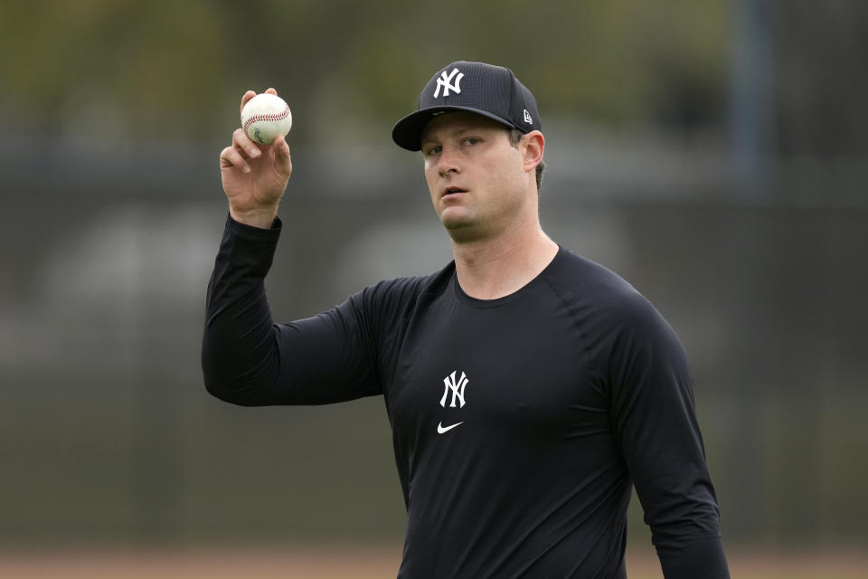 New York Yankees starting pitcher Gerrit Cole walks on the field during a baseball spring training workout Thursday, Feb. 15, 2024, in Tampa, Fla. (AP Photo/Charlie Neibergall)