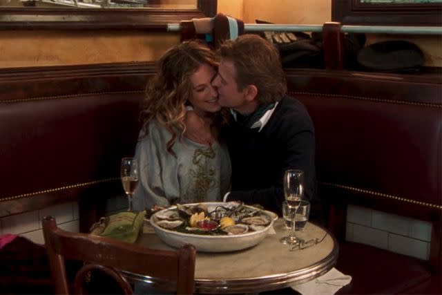 <p>HBO</p> Pastis Restaurant in 'Sex and the City'. Sarah Jessica Parker as Carrie Bradshaw, Mikhail Baryshnikov as Alexsandr Petrovsky.