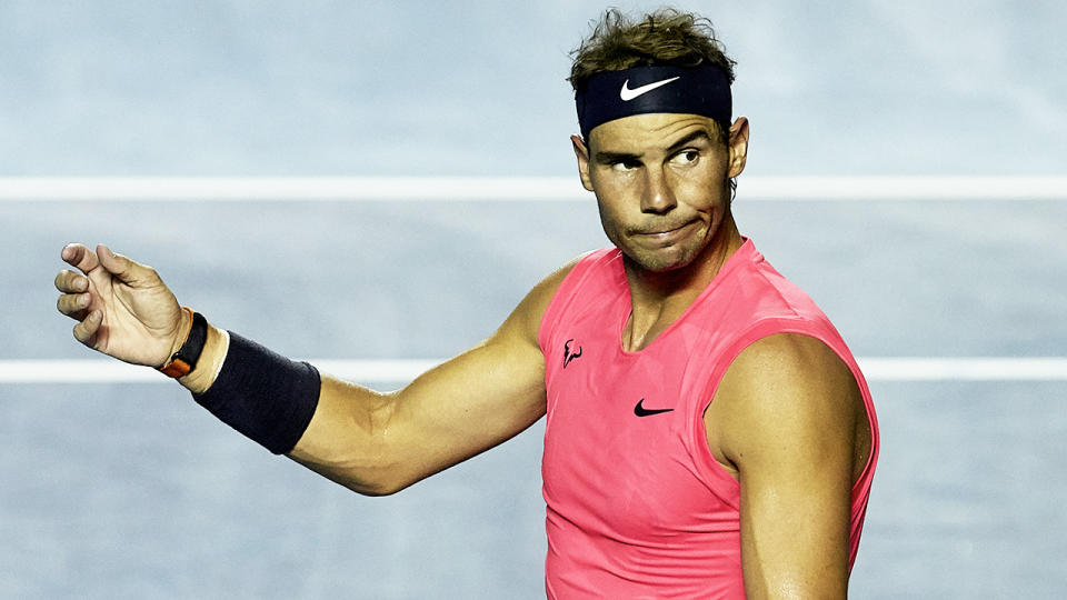 Rafael Nadal gestures and looks dejected after a point.