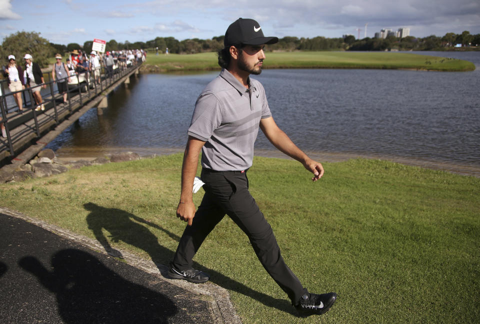 Abraham Ancer of Mexico walks on the 17th fairway on his way to winning the Australian Open Golf tournament in Sydney, Sunday, Nov. 18, 2018. (AP Photo/Rick Rycroft)