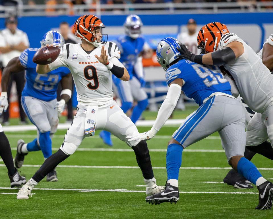 Cincinnati Bengals quarterback Joe Burrow (9) looks to pass the ball against the Detroit Lions in the second quarter at Ford Field.