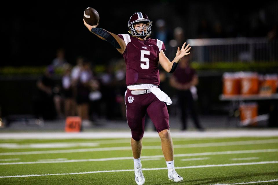 First Baptist Academy's Ty Keller (5) jumps to pass the ball during the Community School of Naples and First Baptist Academy football game on Friday, Oct. 29, 2021 at First Baptist Academy in Naples, Fla. 