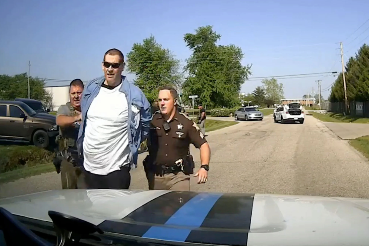 Casey White is taken into custody in Evansville, Ind., on Monday. (Video still via the Evansville Police Department)