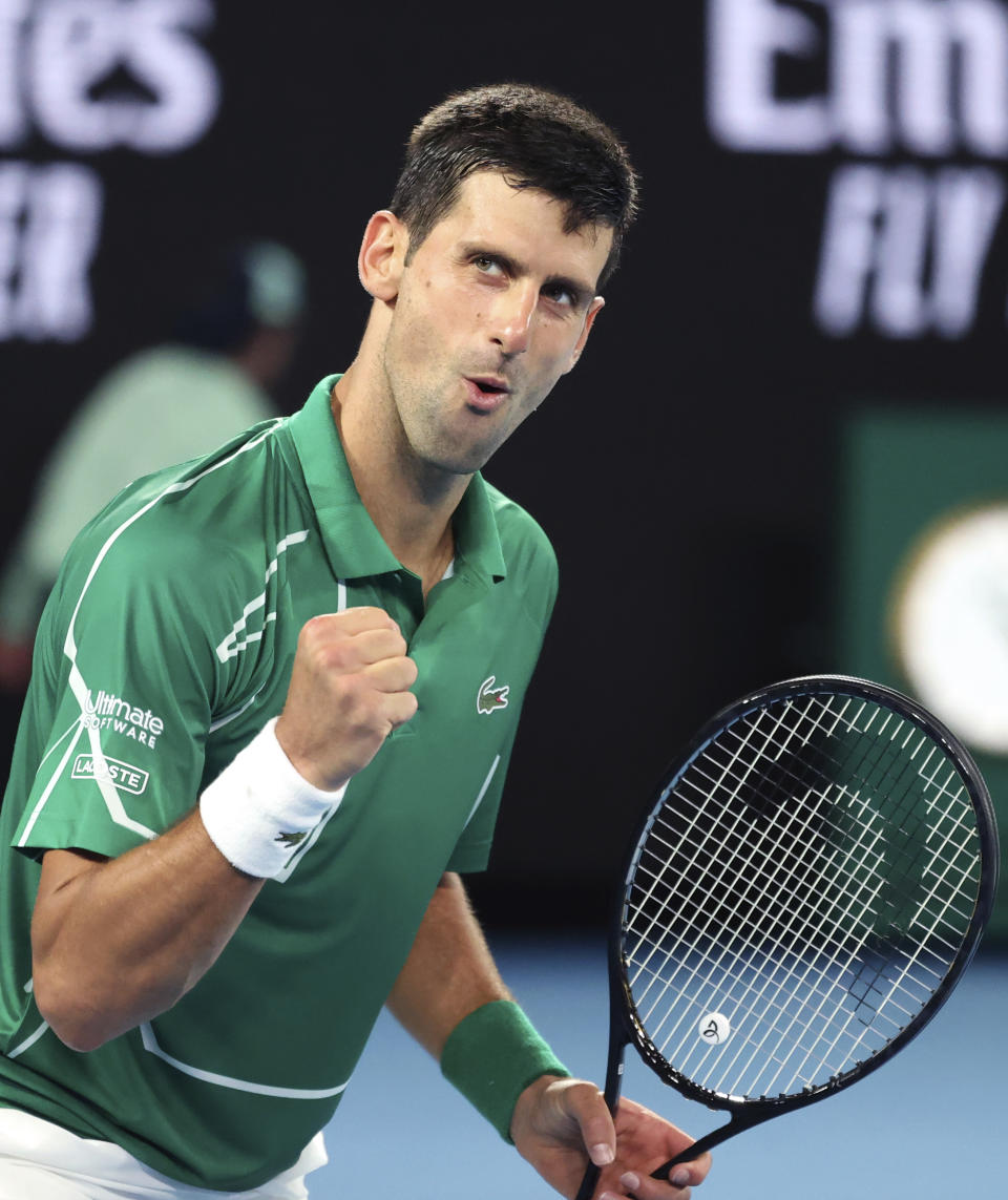 Serbia's Novak Djokovic reacts after winning a point against Germany's Jan-Lennard Struff at the Australian Open tennis championship in Melbourne, Australia, Monday, Jan. 20, 2020. (AP Photo/Lee Jin-man)