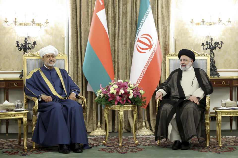 In this photo released by the office of the Iranian Presidency, Oman's Sultan Haitham bin Tariq Al Said, left, and Iranian President Ebrahim Raisi meet at the Saadabad Palace in Tehran, Iran, Sunday, May 28, 2023. Oman has a long record of being a key broker between Iran and the West, amid volatile regional tensions. (Iranian Presidency Office via AP)