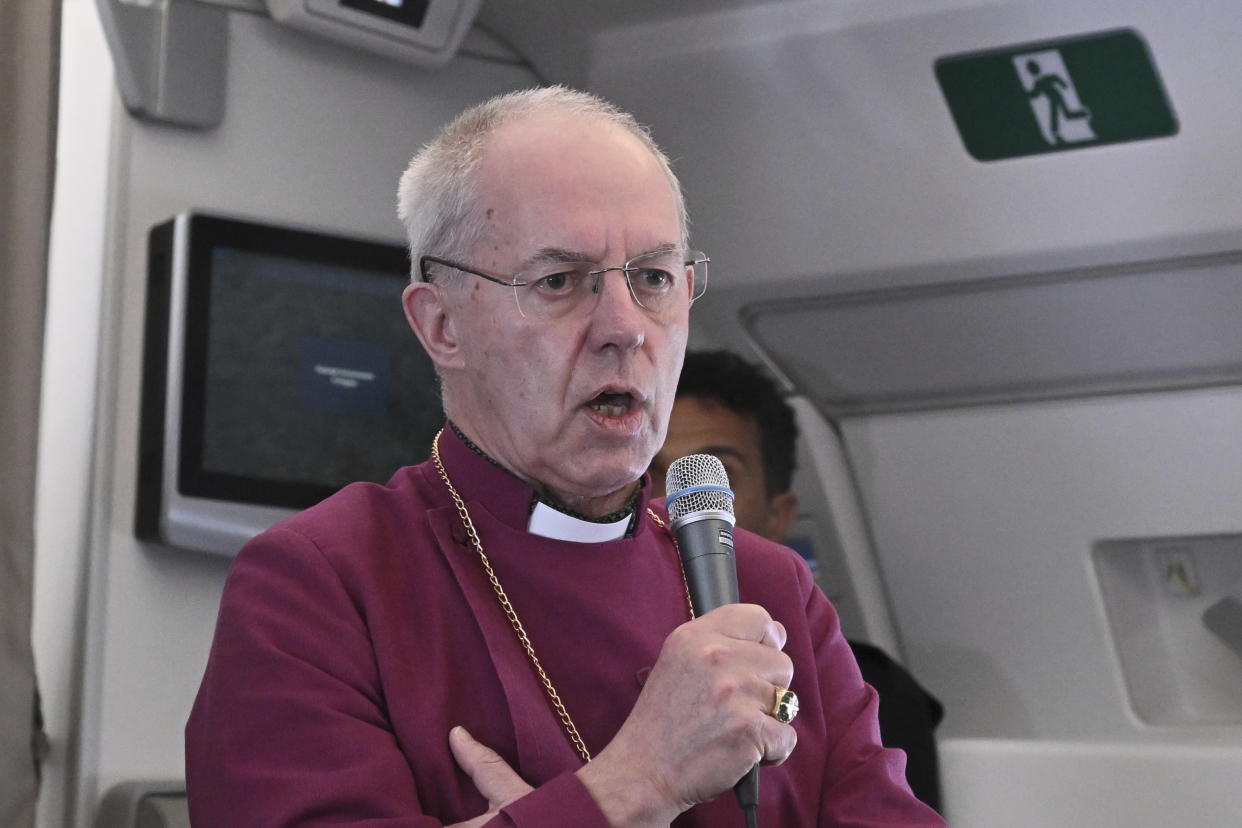 The Archbishop of Canterbury Justin Welby meets the journalists during an airborne press conference aboard the airplane directed to Rome, at the end of Pope Francis pastoral visit to Congo and South Sudan, Sunday, Feb. 5, 2023. (Tiziana Fabi/Pool Photo Via AP)
