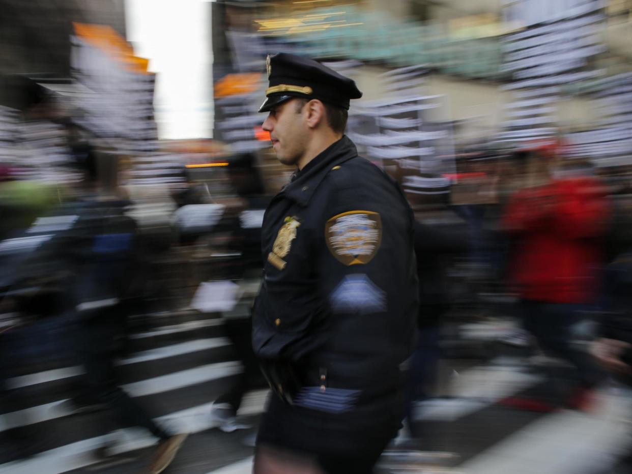 A news release about the legislation mentioned people throwing water over uniformed NYPD officers: Kena Betancur/Getty Images