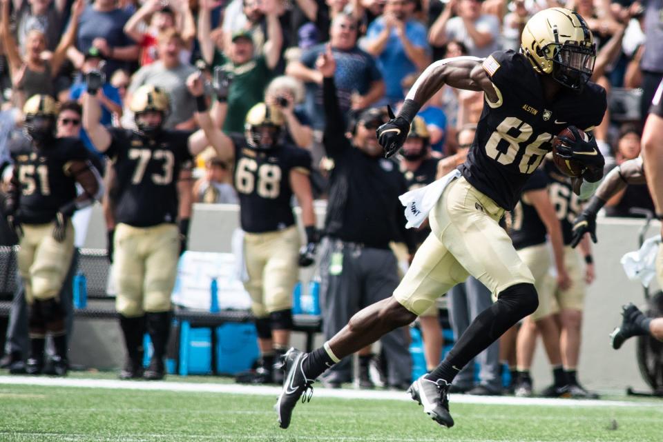 Army's Isaiah Alston drives up field during the football game against the University of Connecticut at the United States Military Academy at West Point in West Point, NY on Saturday, September 18, 2021. West Point defeated UConn 52-21.