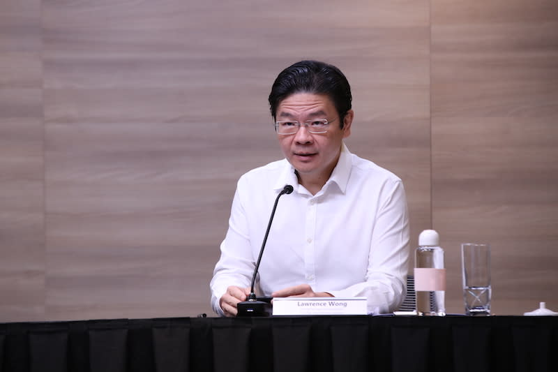 National Development Minister and multi-ministry taskforce on COVID-19 co-chair Lawrence Wong addresses reporters at a virtual press conference oin May 2020. PHOTO: MCI