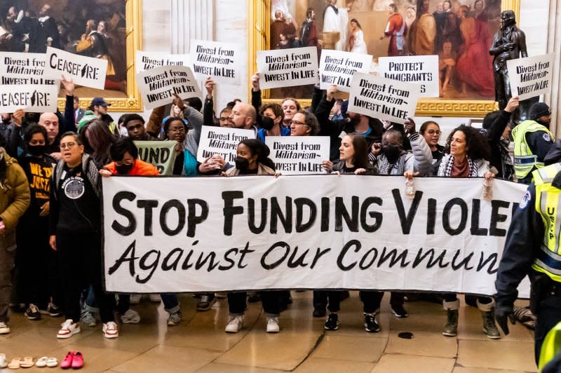 Protesters demonstrate for a permanent cease-fire in the Israel-Hamas war in the Rotunda of the U.S. Capitol in Washington on December 19. File Photo by Julia Nikhinson/UPI