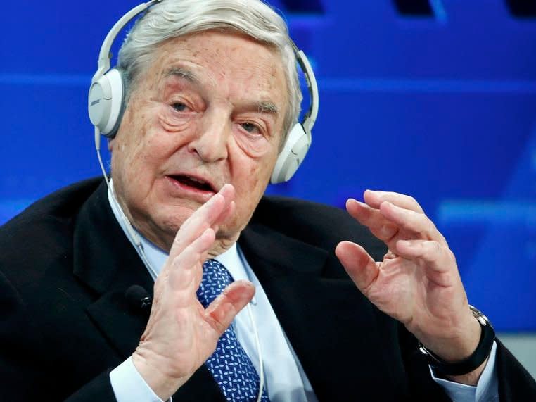 Georges Soros, Chairman of Soros Fund Management, speaks during the session 'Recharging Europe' in the Swiss mountain resort of Davos January 23, 2015.  REUTERS/Ruben Sprich